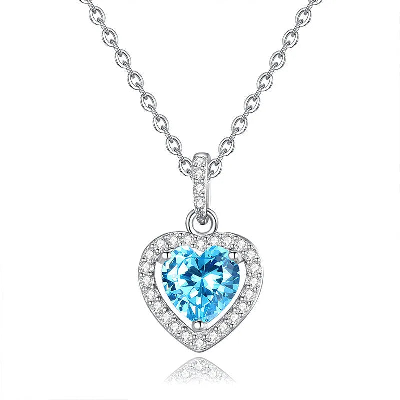 Sterling silver heart pendant necklace with a choice of coloured gemstones on a cross chain.