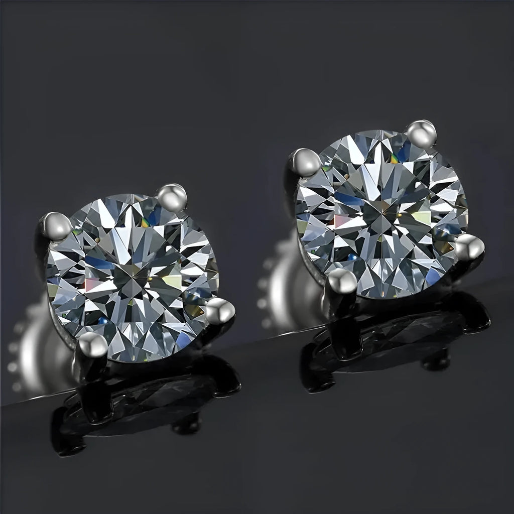 Silver geometric screw-back stud earrings with four-claw moissanite setting on black card