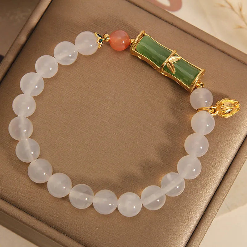 Women's white agate jade bracelet with bamboo joint beads in a retro Chinese style.