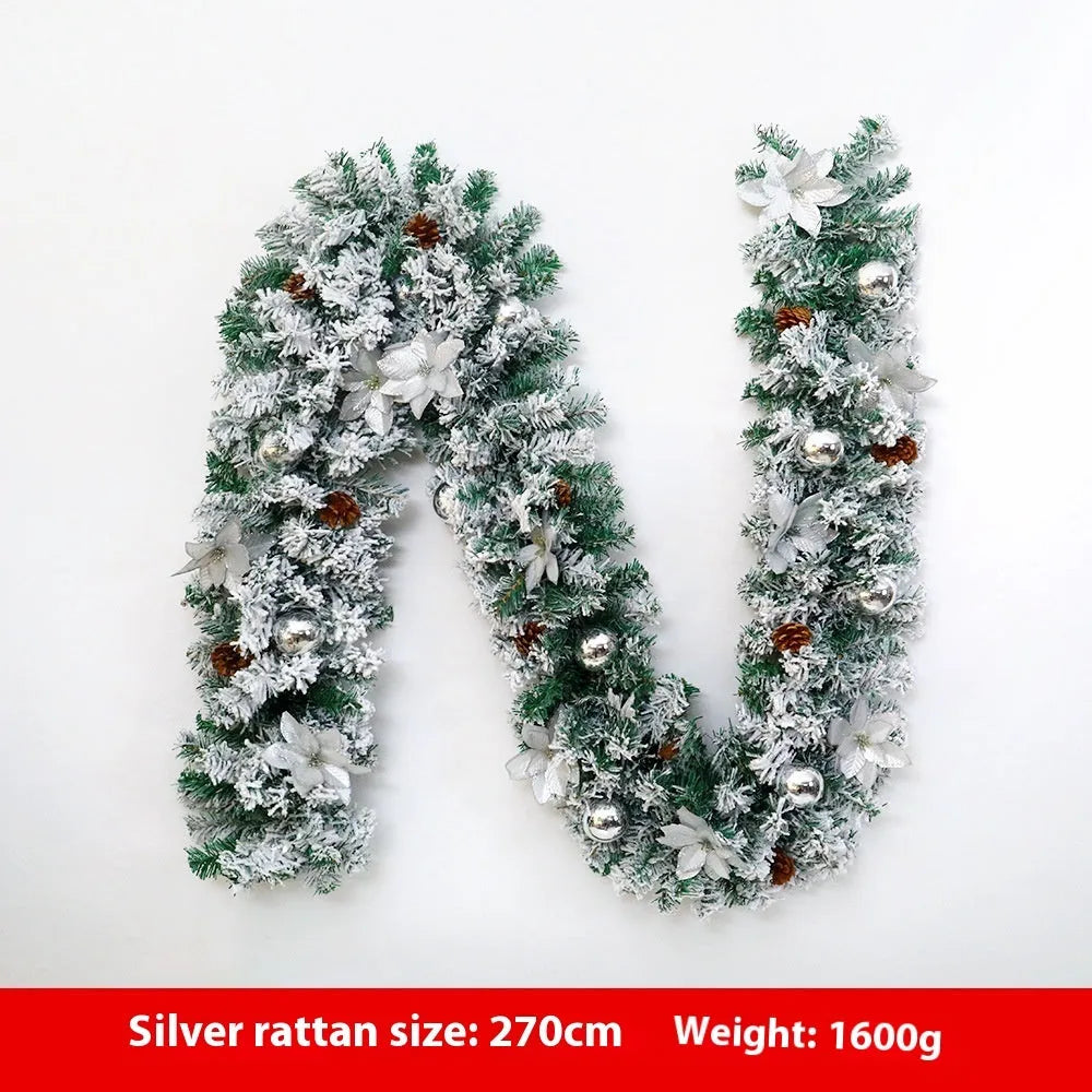 PVC Christmas rattan garland with flocked finish in golden colour option draped over mantelpiece