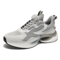 Men's low-top sports shoes with a rotating buckle closure and mesh uppers in a solid colour.