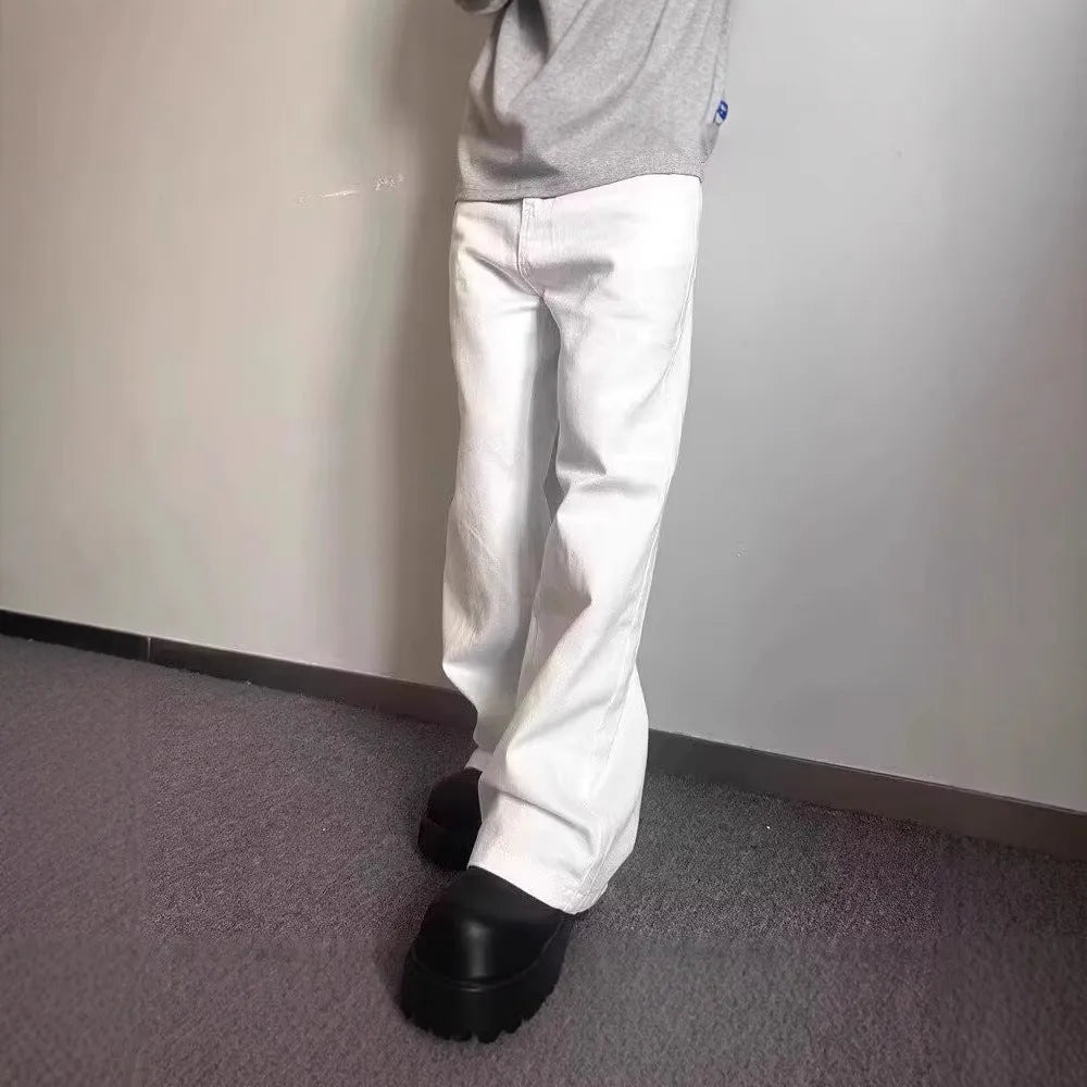 White men's straight-leg jeans with a wide loose cut on a mid waist, featuring a zipper fly.