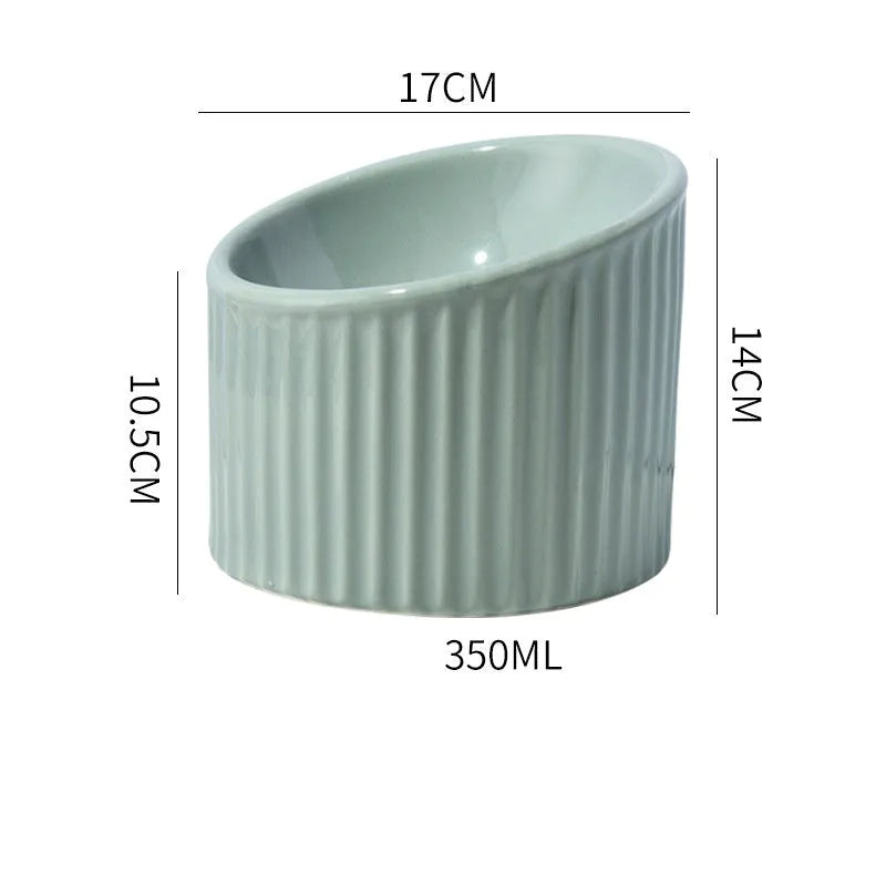 Elevated ceramic cat bowl in green colour showing raised, tilted design for food or water.