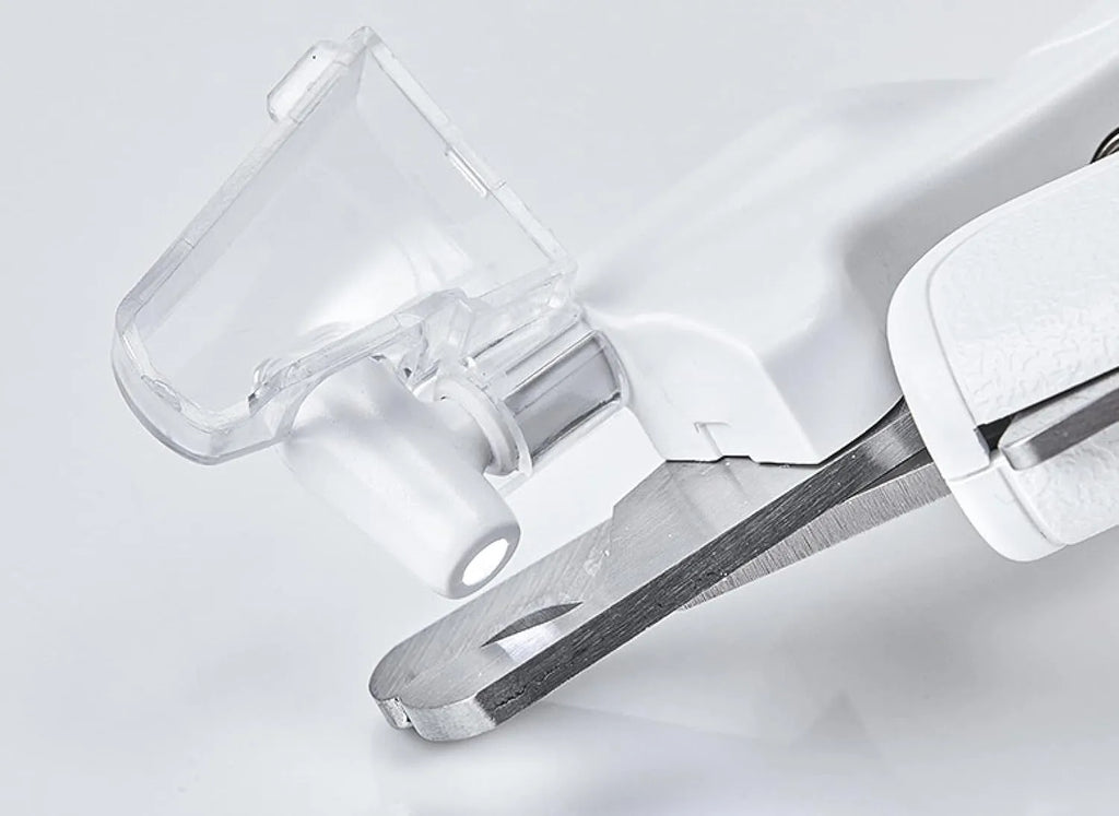 White LED pet nail clipper with a transparent anti-splash guard and a nail file on a white background.