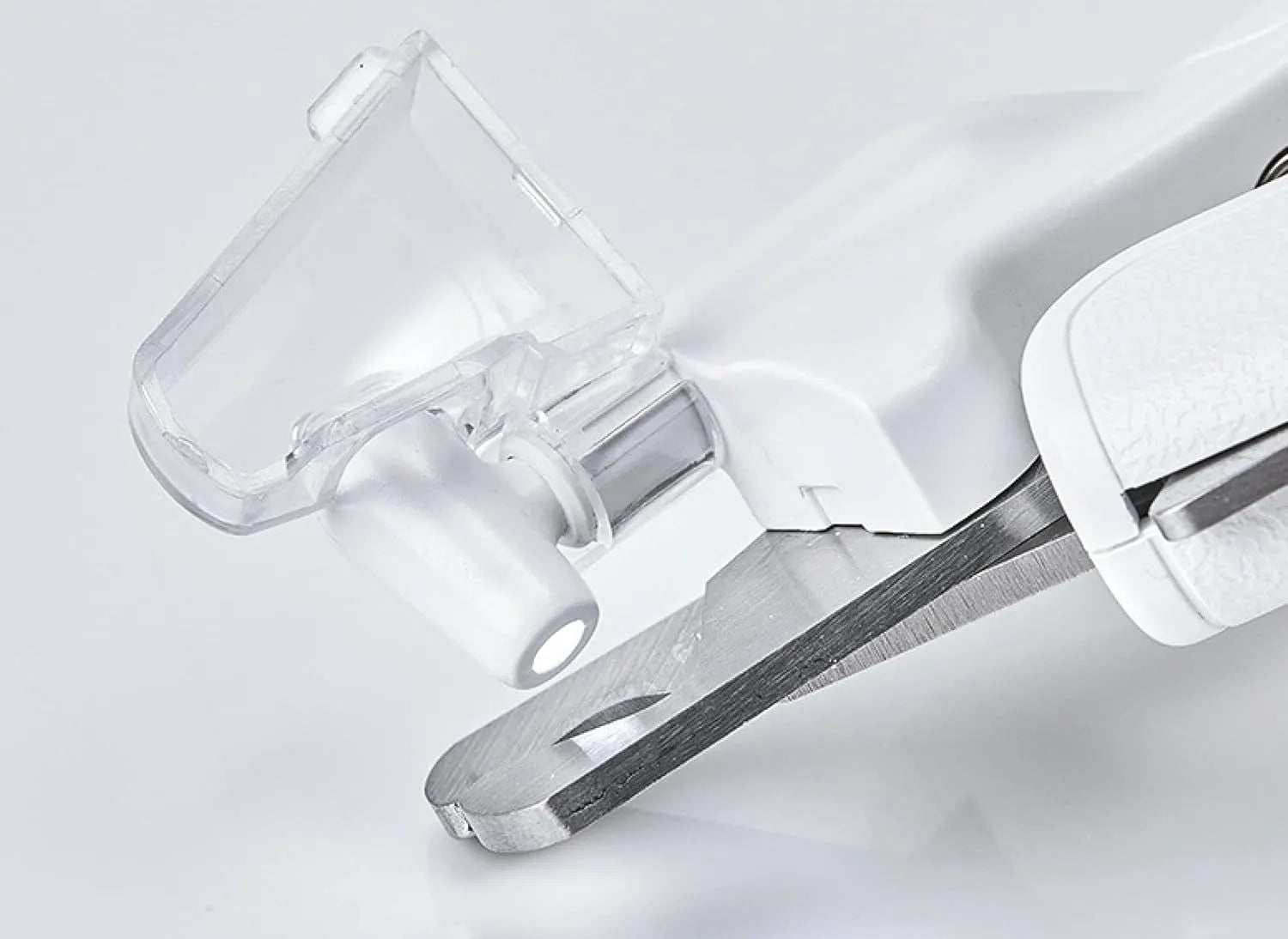 White LED pet nail clipper with a transparent anti-splash guard and a nail file on a white background.