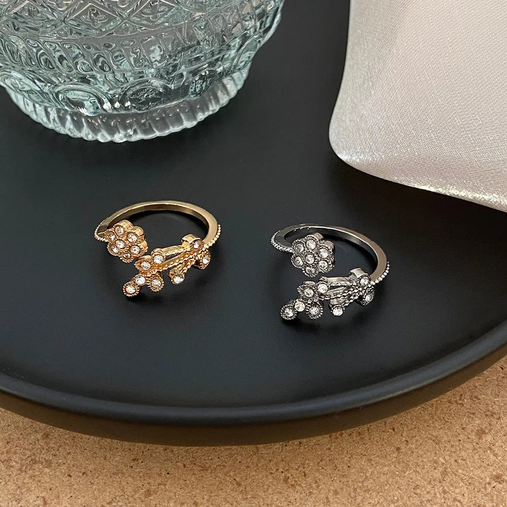 Copper open ring with diamond-treated floral leaf design in gold or white colour.