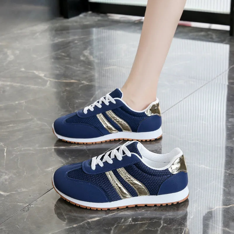 Blue women's casual tennis shoes with cross shoulder straps and white rubber sole