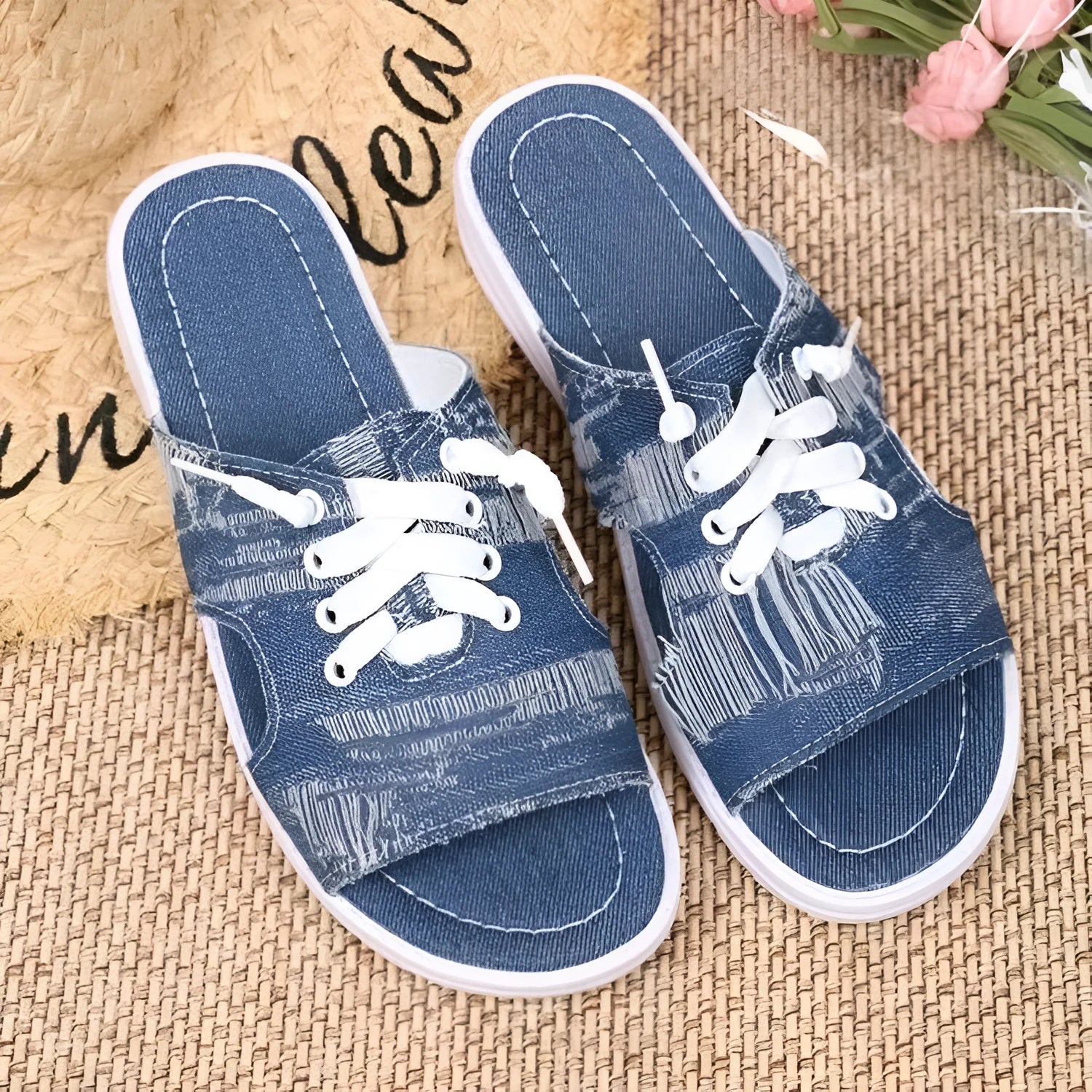 Blue Roman style canvas slippers with cloth upper and rubber sole displayed in adult sizes