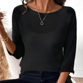 Thin knitted off-shoulder top for women with 3/4 sleeves and a see-through 3D pattern in multiple colour options.