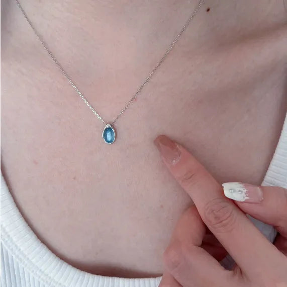 Navy blue water drop necklace with geometric pendant on cross chain, adjustable length jewellery