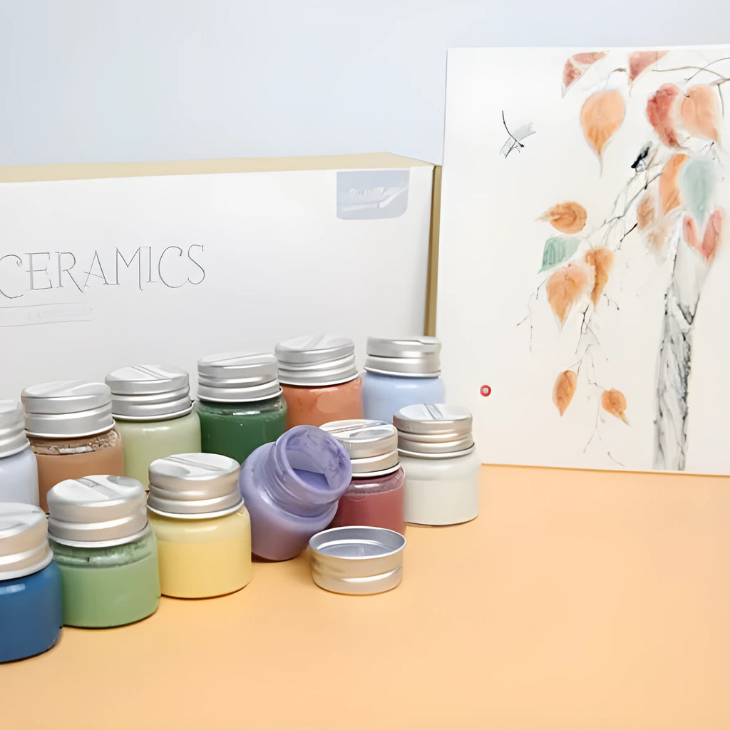 Pots of Morandi colour ceramic glaze paint in Lilac, Plant Ash, and Verdant for high temperature pottery firing.