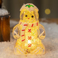Glowing gingerbread man Christmas ornament with LED light and red scarf, measuring 6.5cm wide by 10.5cm tall