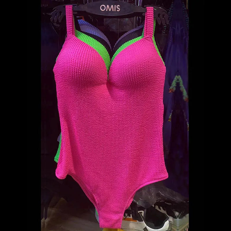 Women's one-piece swimsuit with sunken stripe pattern in polyester fabric available in multiple colours