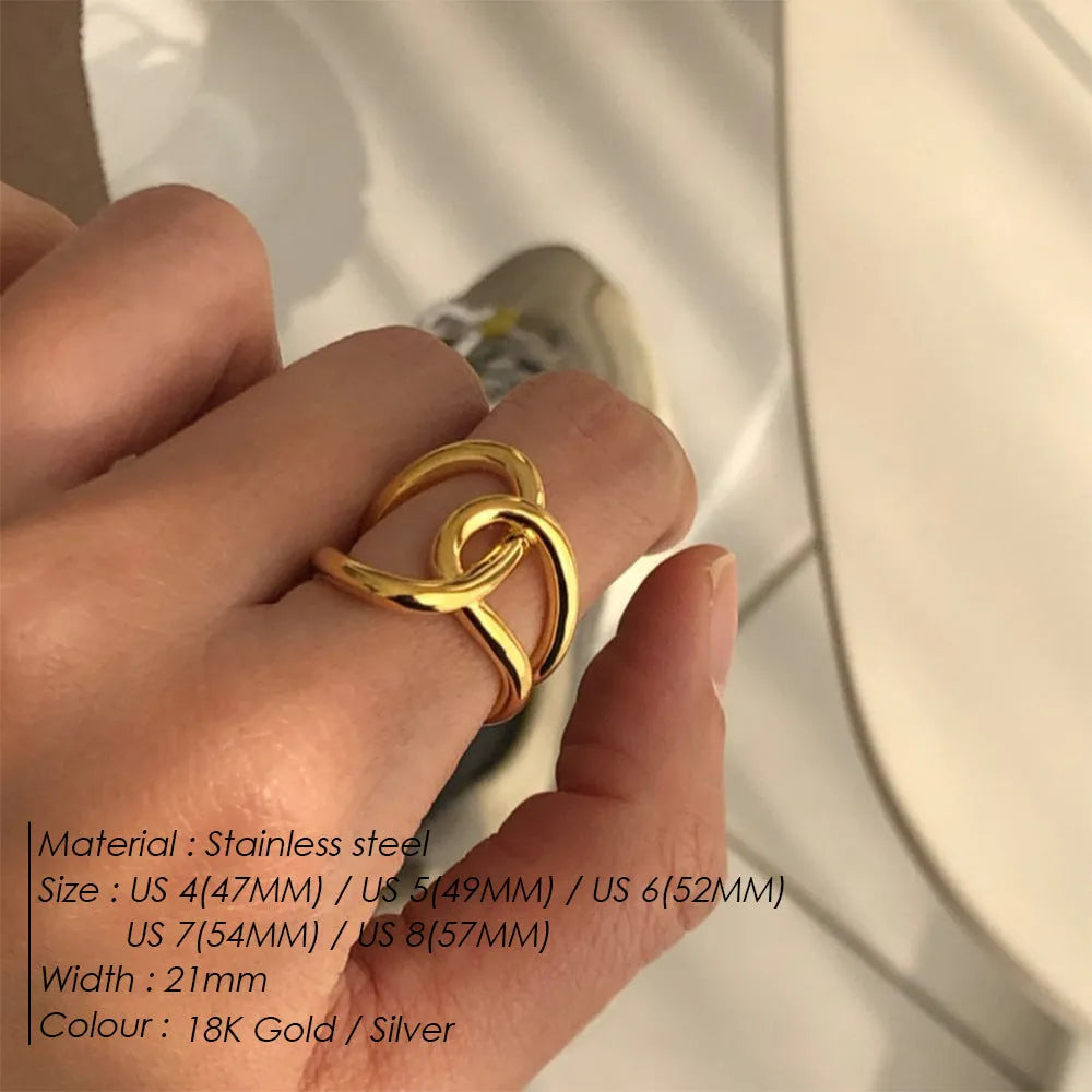 Adjustable knotted women's ring in stainless steel with geometric U-shape, shown in gold and steel colours.