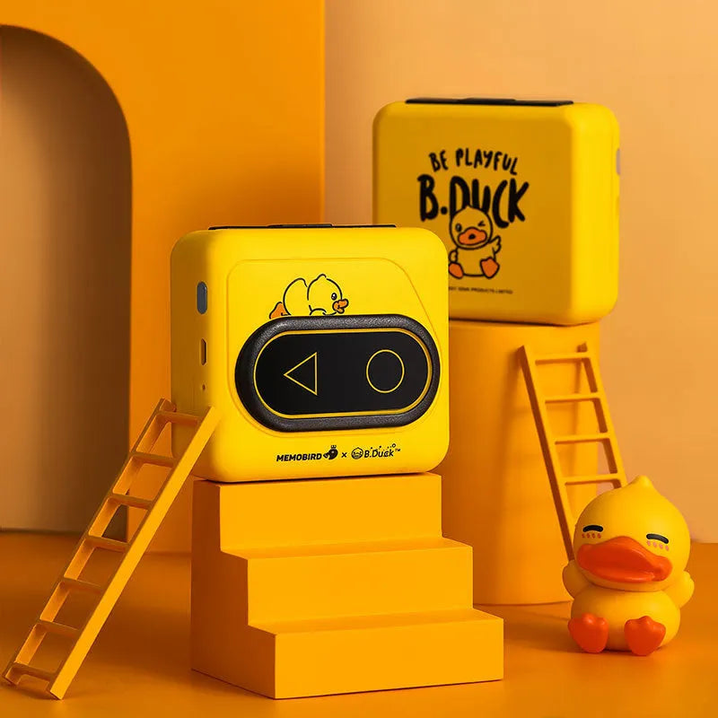 Portable Bluetooth thermal mini printer in avocado green, pink, yellow duck, or white, showing compact size next to a smartphone.
