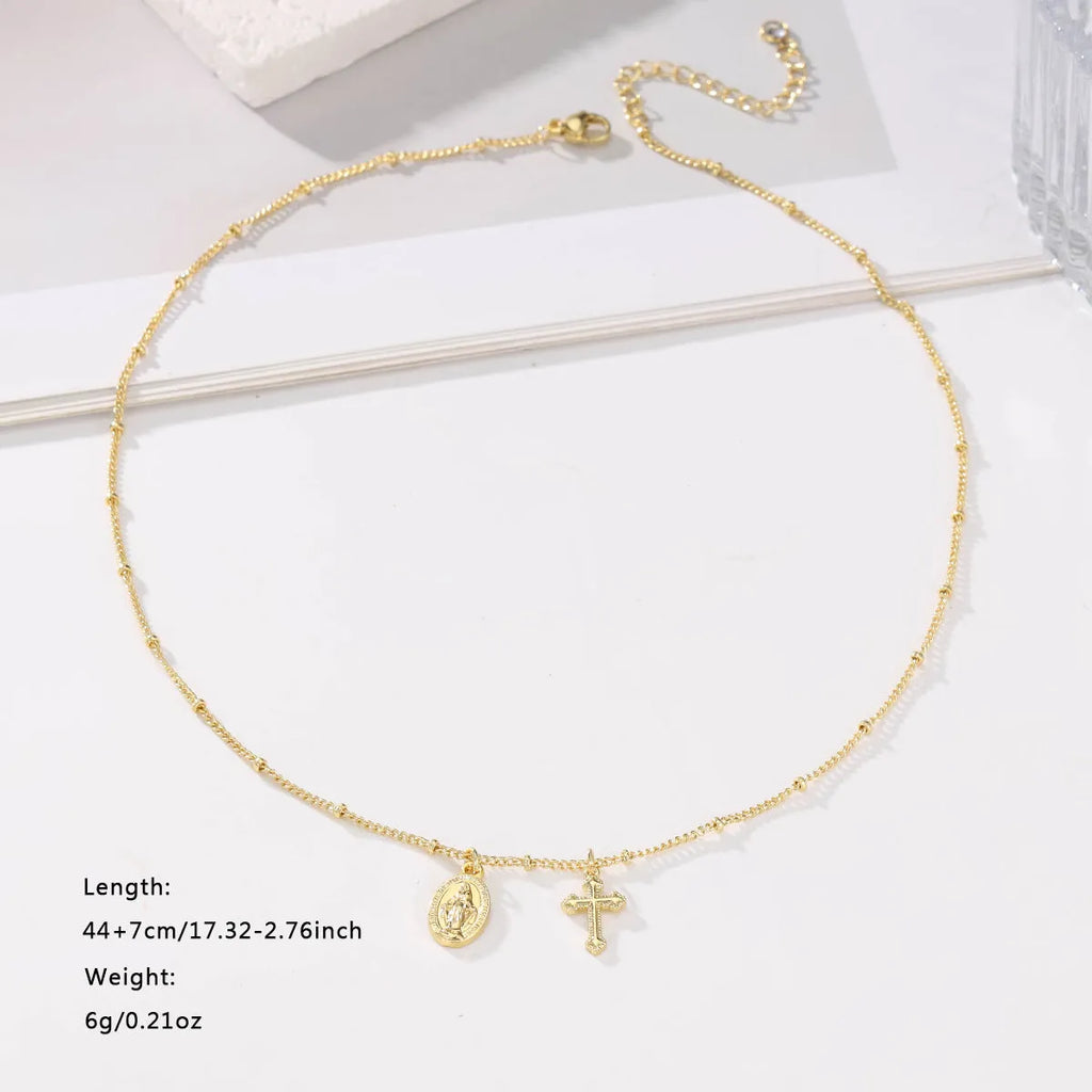 Gold geometric cross Virgin Mary necklace for women on a chain.