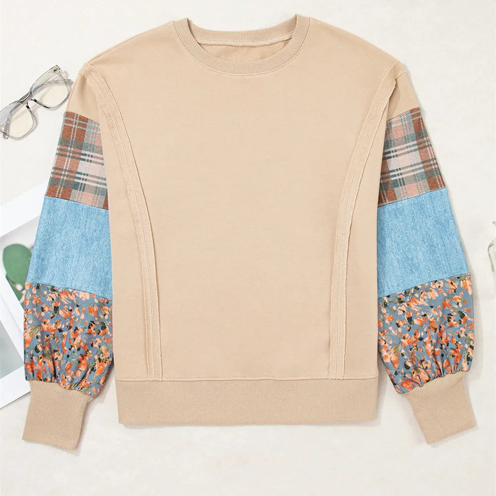 Women's beige and red plaid long-sleeved loose-fit polyester top on a hanger.