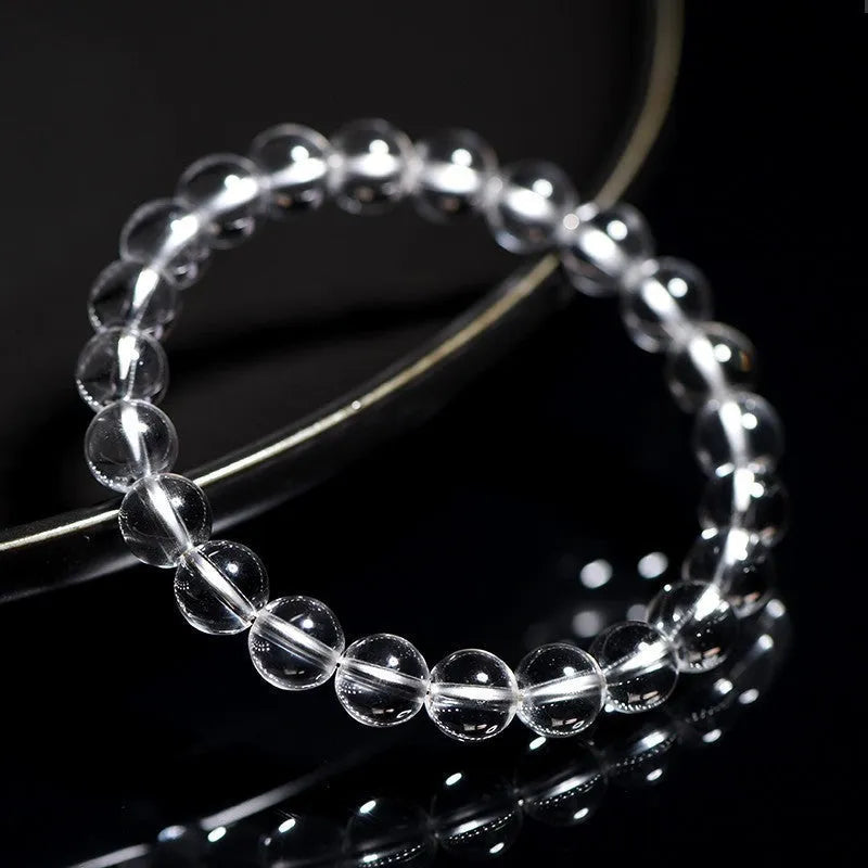 Natural Donghai white crystal bracelet with round water beads on a wrist, showing geometrical unisex design.