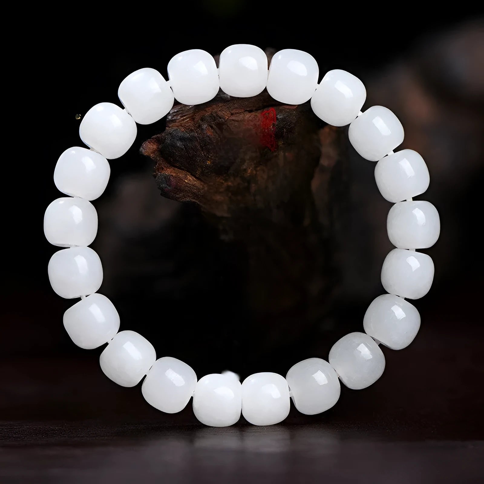 White Hetian jade barrel bead bracelet showing three size options on a neutral background