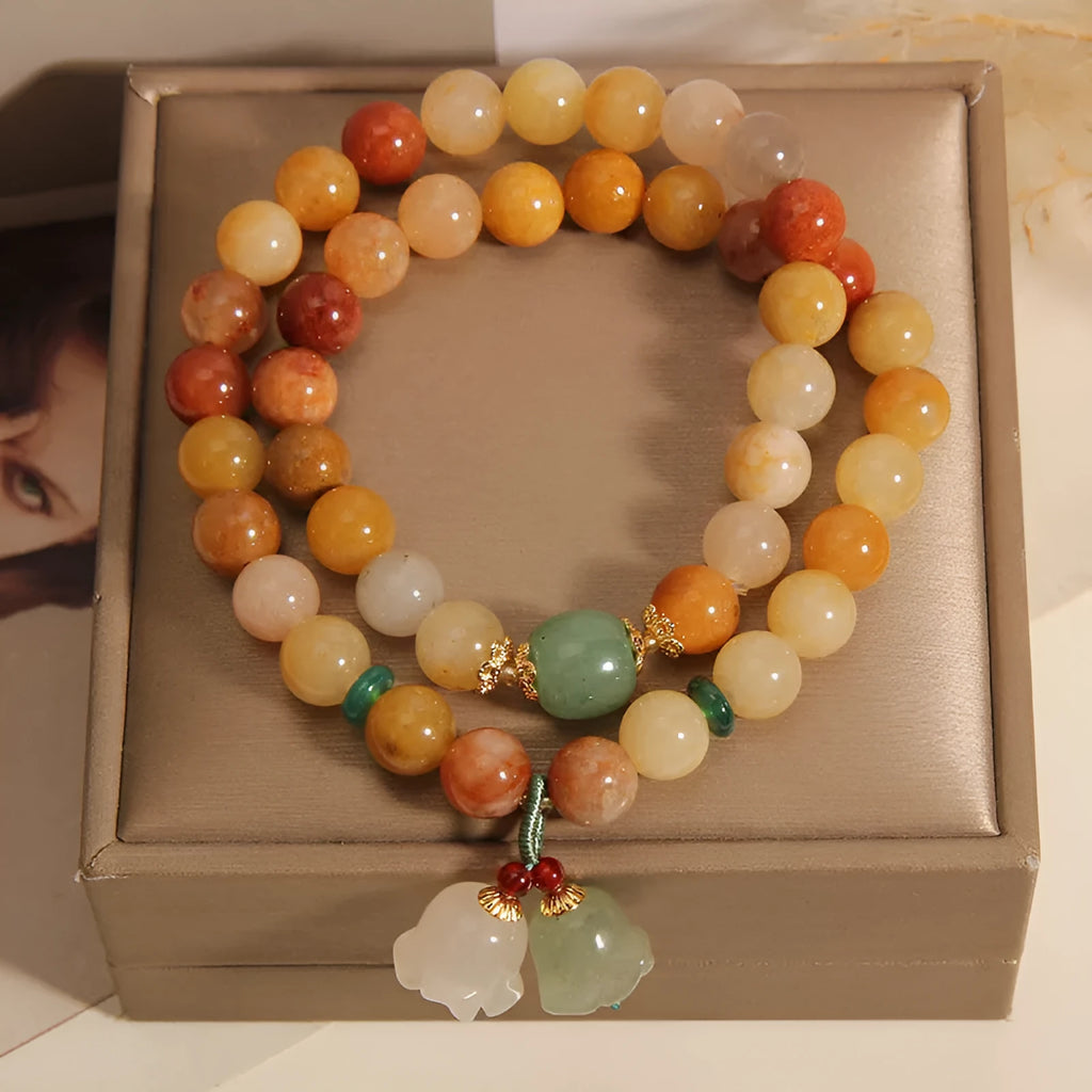Natural Jinsi Jade multi-layer bracelet for women with orchid pendant on green background