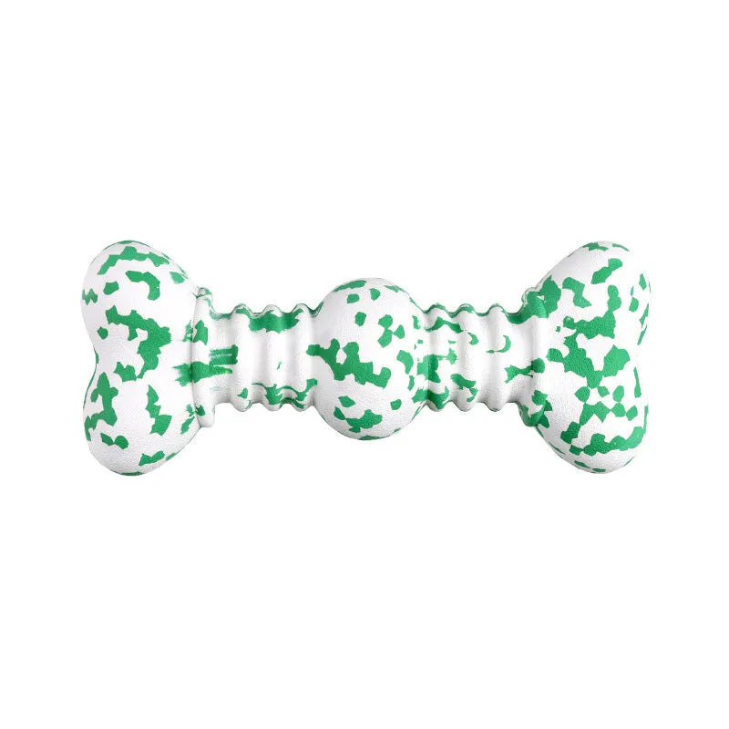 Green and white camouflage patterned natural rubber bone-shaped dog chew toy for large dogs on a wooden floor.