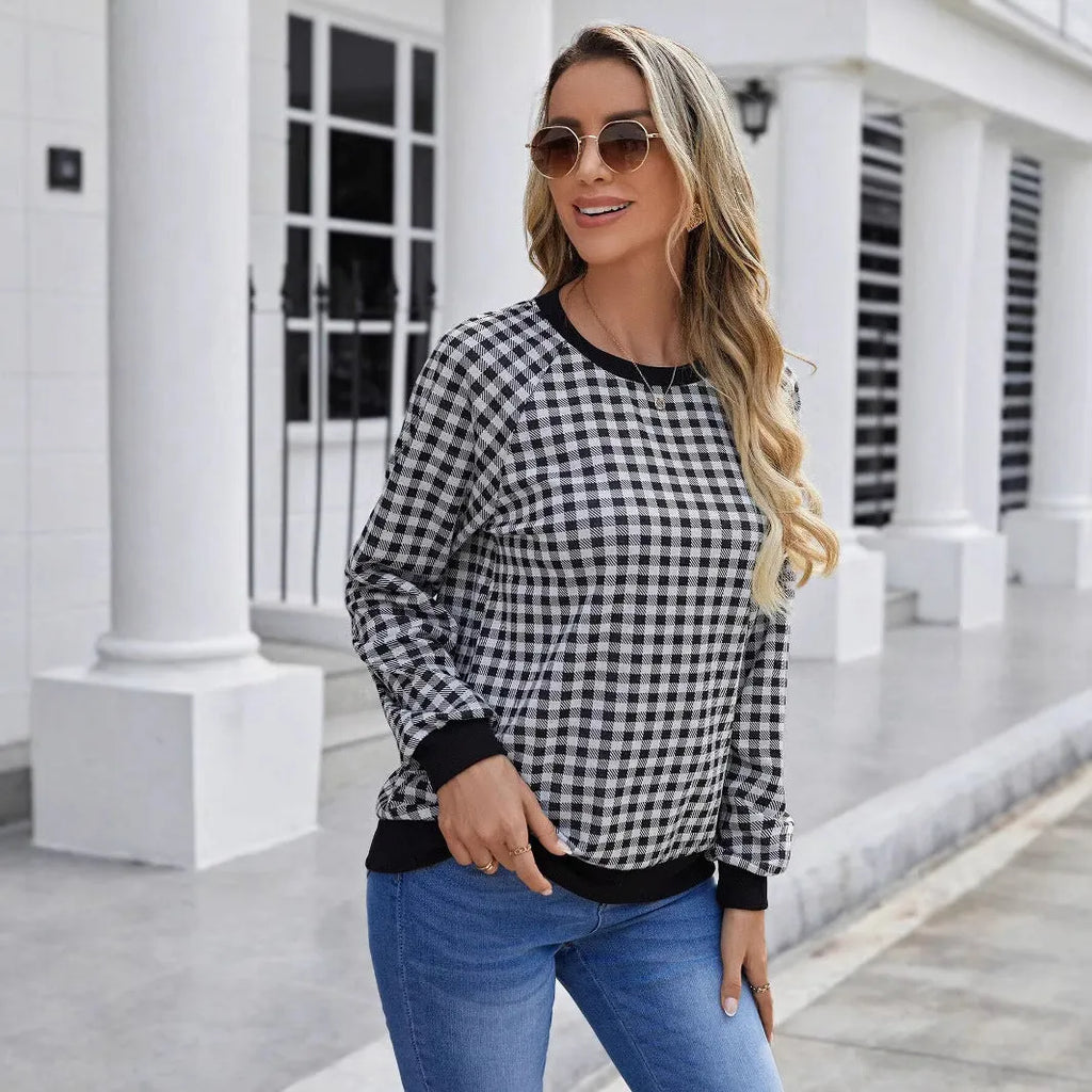 Black long sleeve pullover sweater with a Japanese plaid pattern, shown on a hanger.