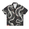 Short sleeve Cuban collar shirt with snake bone and floral pattern print in a loose fit.