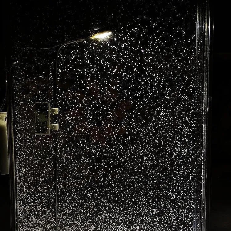 DIY snowflake night light kit showing magical snowy landscape scene with warm LED glow