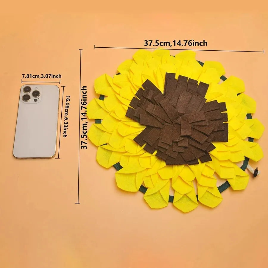 Yellow sunflower-shaped dog snuffle mat with fleece texture and a buckle strap for non-slip use.