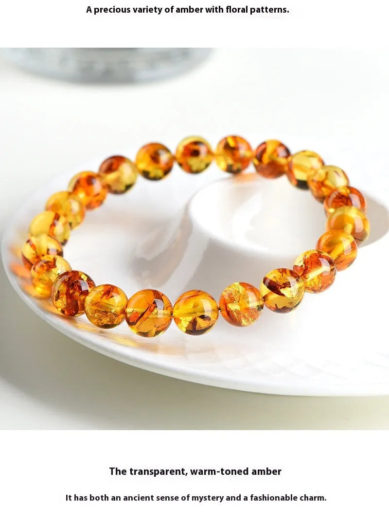 Natural yellow piebald amber bracelet with polished geometric beads on a string