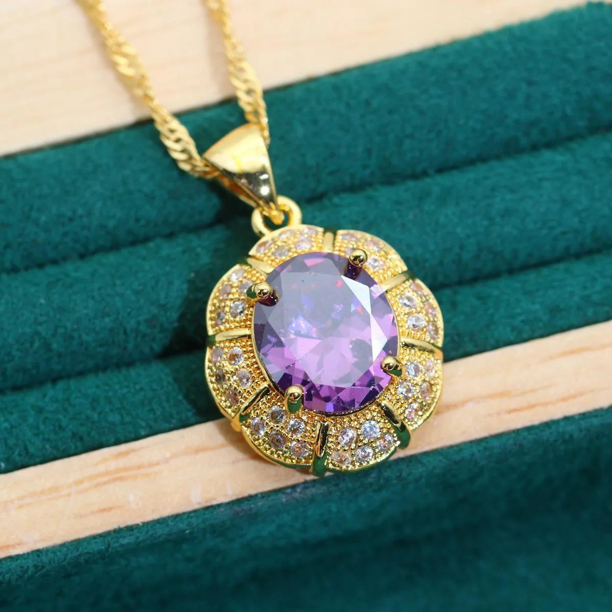 18k gold plated jewellery set with ring, earrings, bracelet and necklace featuring coloured zircon stones.