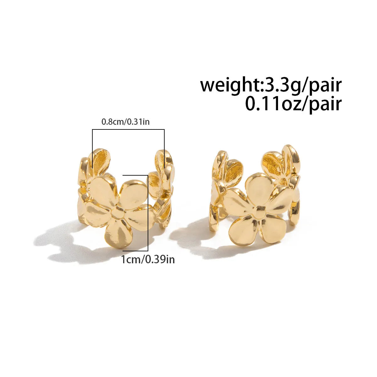 Gold tone women's earrings with starfish and conch shell design
