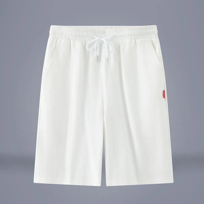Casual cropped trousers in cotton-linen fabric with a drawstring waist, shown in a solid colour.