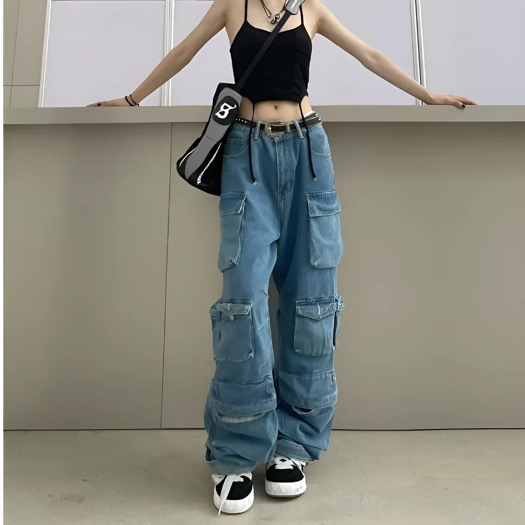 Women's blue high waist wide leg denim jeans with multiple pockets on a neutral background.