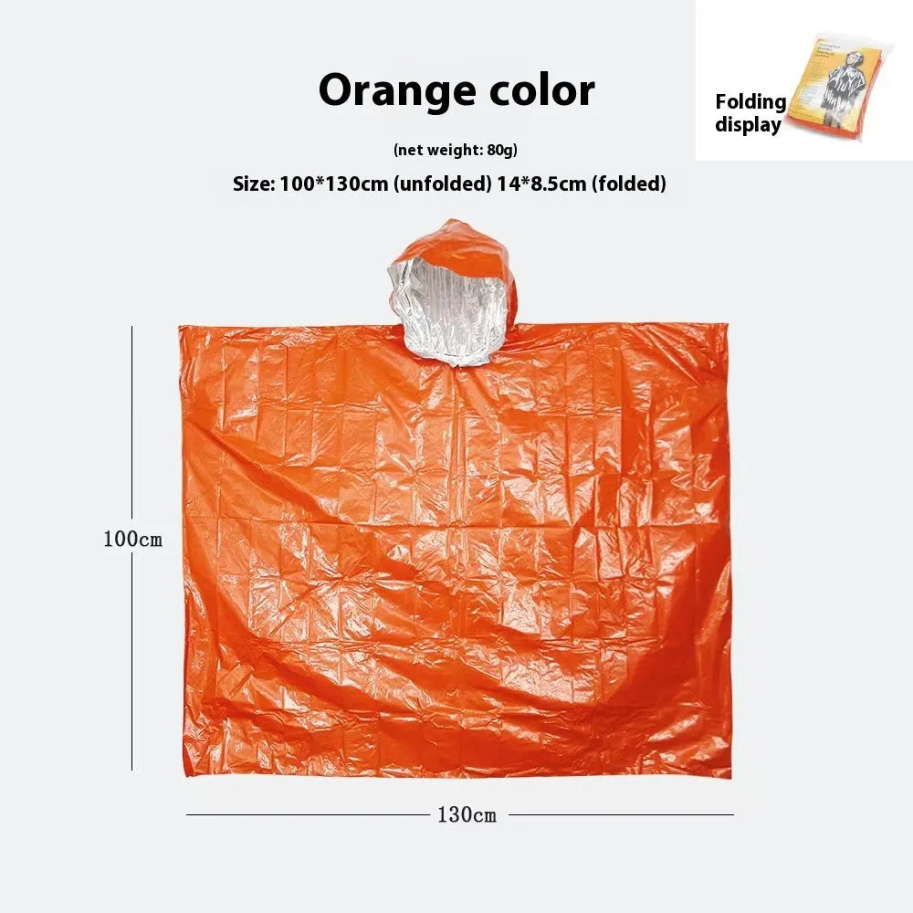 Adult in orange Marathon Wild cross-country rain poncho outdoors in rain.