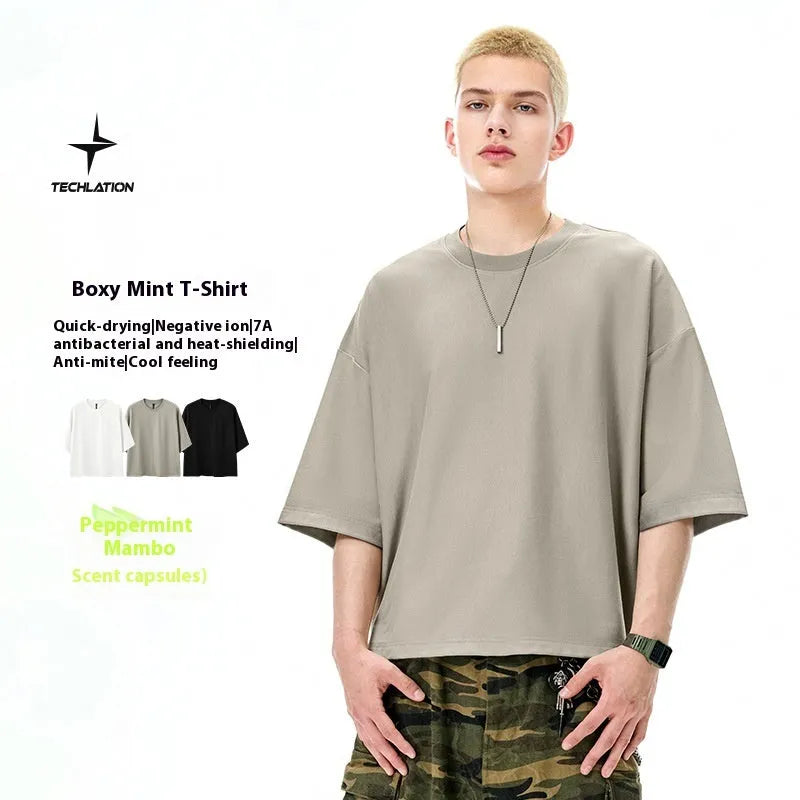 Men's loose fit short sleeve t-shirt in cotton-polyester blend available in black and sand grey colours