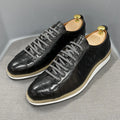 Men's white low-top sneakers with an embossed pattern and front lace-up closure.