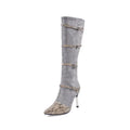 Grey and black women's knee high boots with a thin high heel and velvet lining.