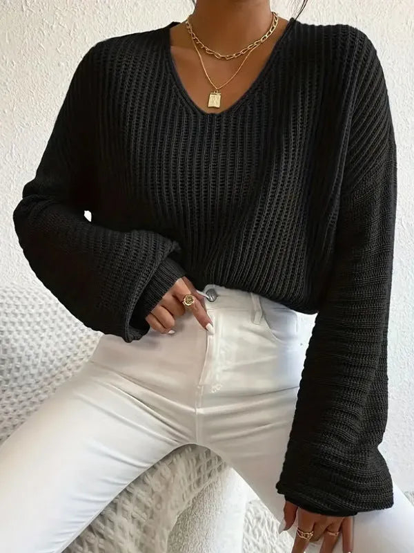 Women's solid colour long sleeve pullover in a loose casual style, shown in one of five available colours.