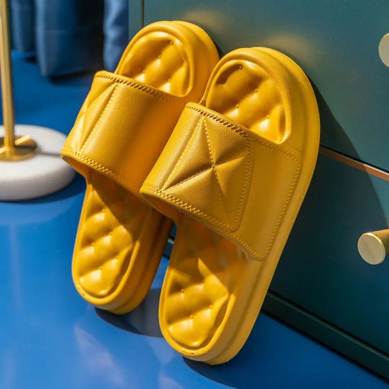 A pair of thick-soled EVA bathroom slippers in a chosen colour, showing the non-slip sole pattern.