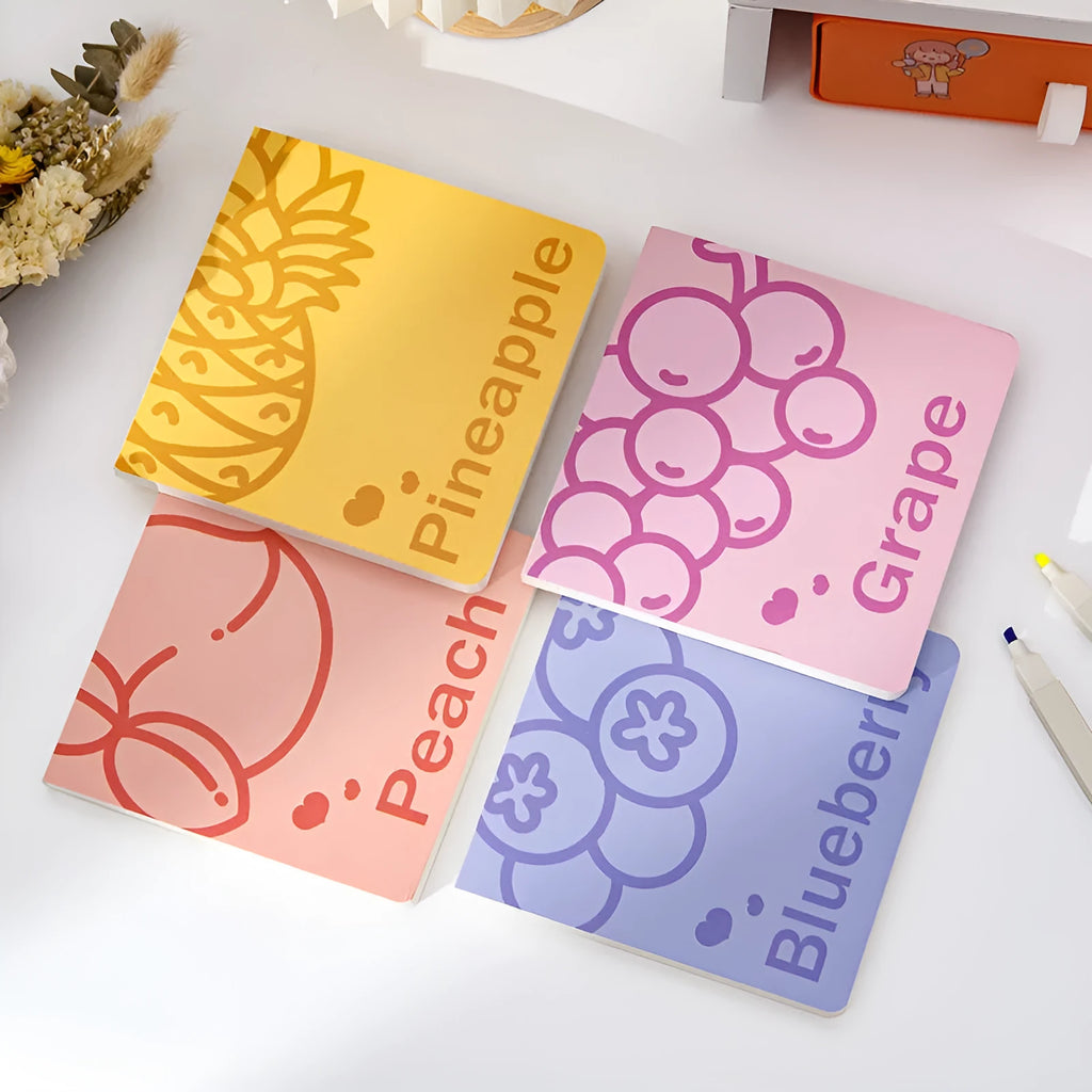 Square fruit design notebook showing embossed pineapple, blueberry, grape, and peach cover options