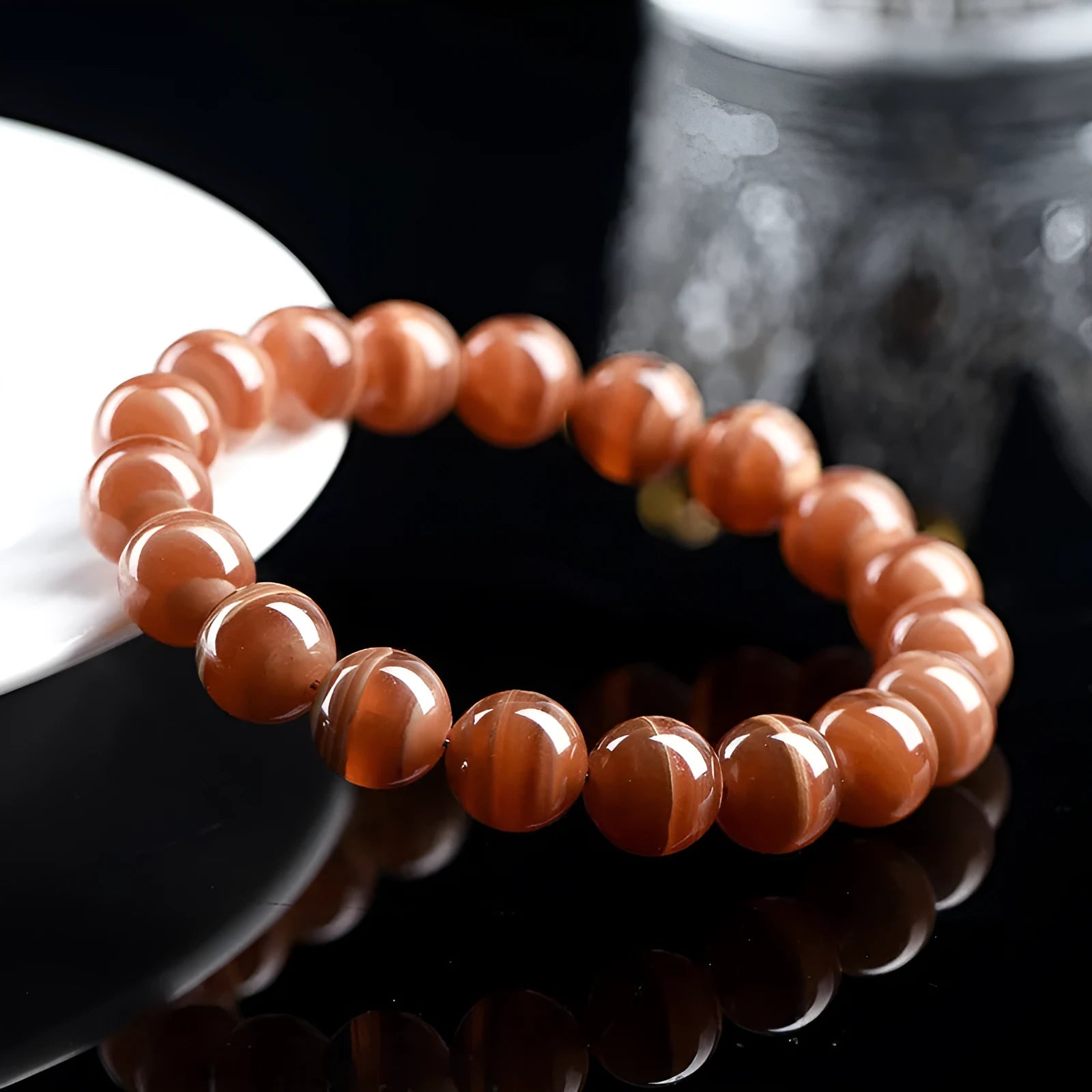 Natural old mine rhodochrosite round bead bracelet with ruyi elements, available in 6mm or 8mm bead sizes.