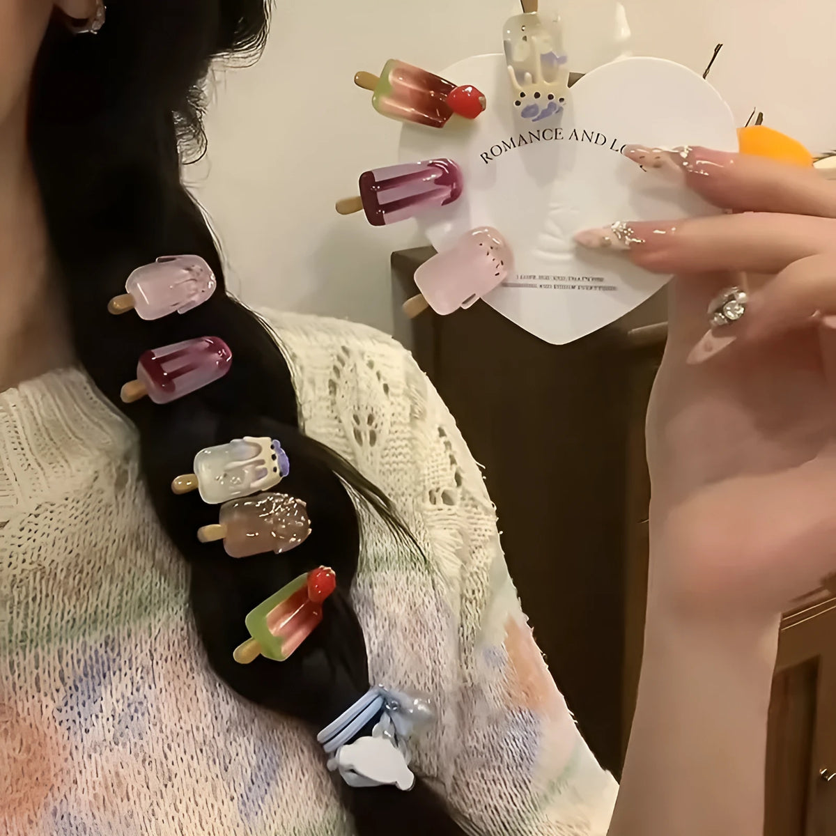 Close-up of a resin hair clip with a cartoon ice cream design in a choice of five colours.