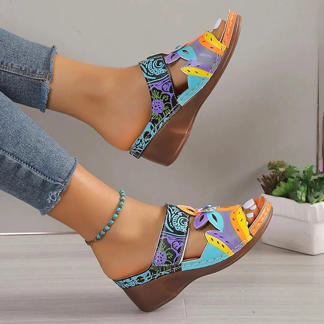 Women's ethnic design slipper sandals with coloured slope and totem pattern on a cowhide upper.