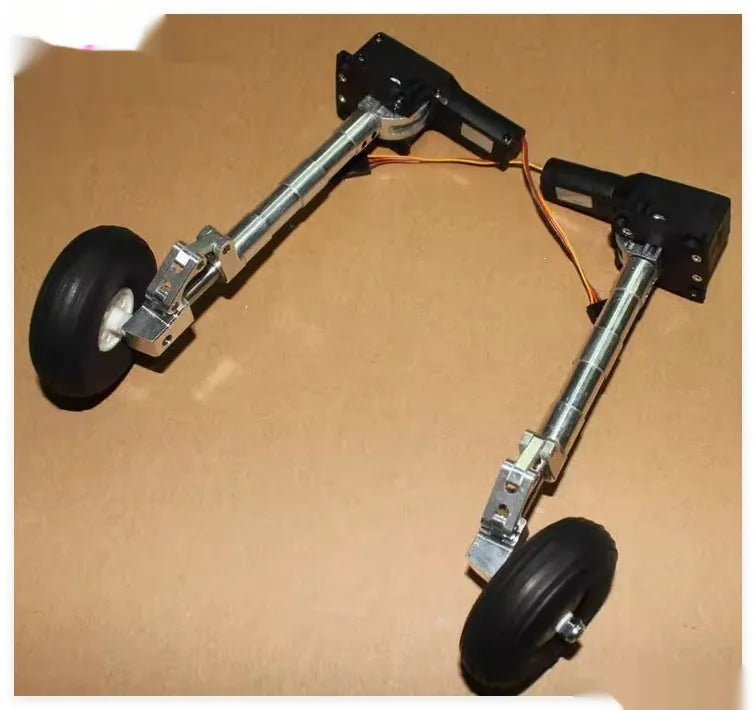 Alloy retractable shock-absorbing landing gear for RC cars with adjustable height and wheel options.