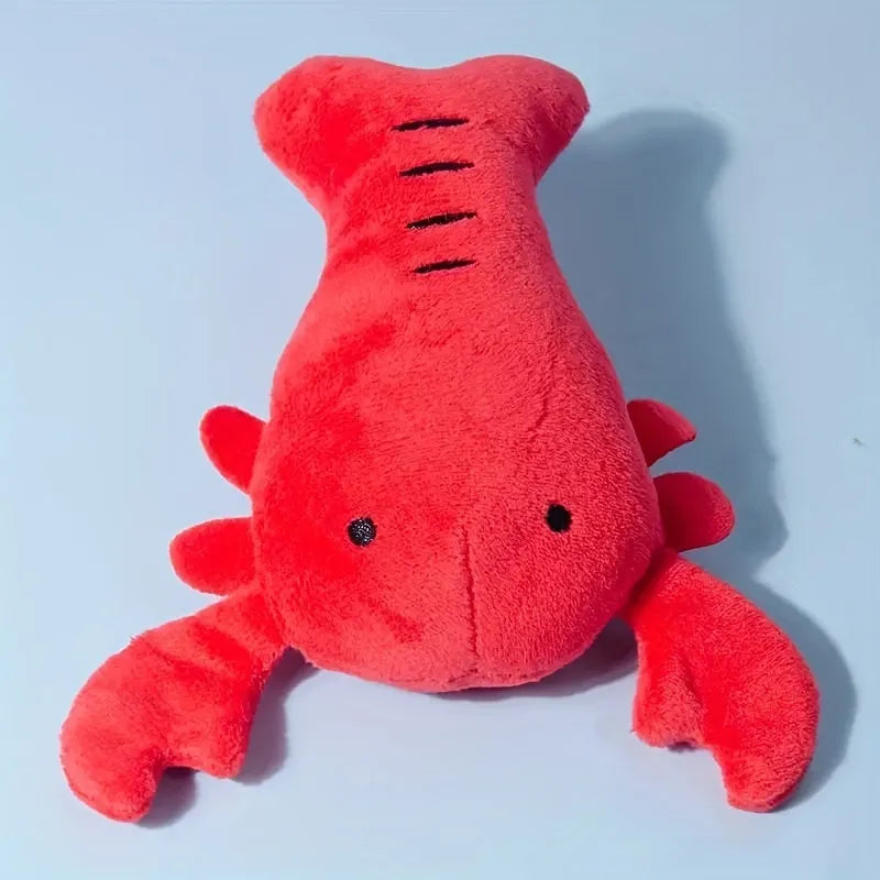 Red lobster shaped squeaky dog toy with soft plush material measuring 12.5cm length