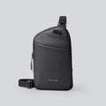 Men's black Oxford cloth crossbody bag showing reinforced stitching and simple design