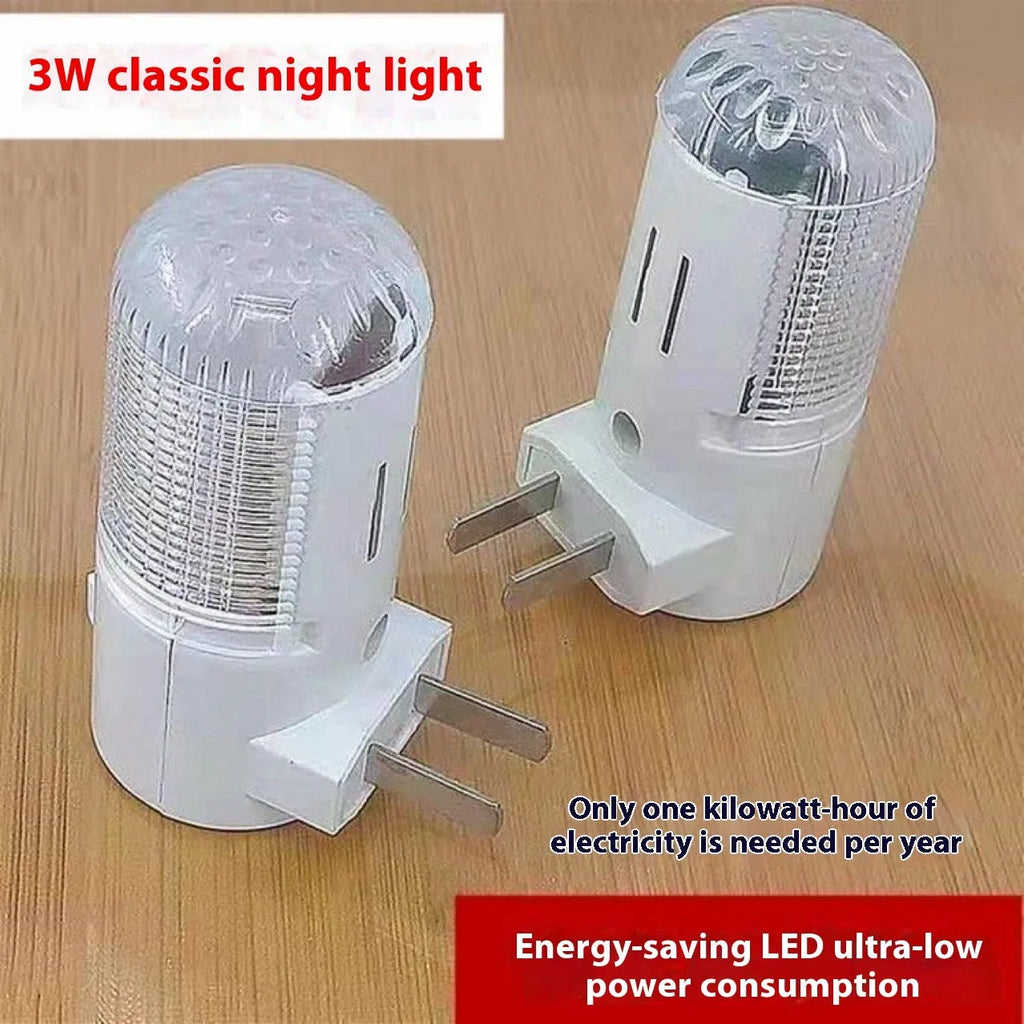 Compact square white minimalist plug-in bedside night light on a surface.