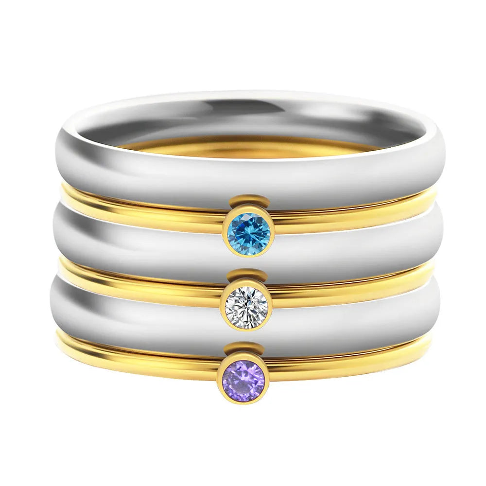 December birthstone titanium steel ring with geometric engraving, shown in gold and stone colours.