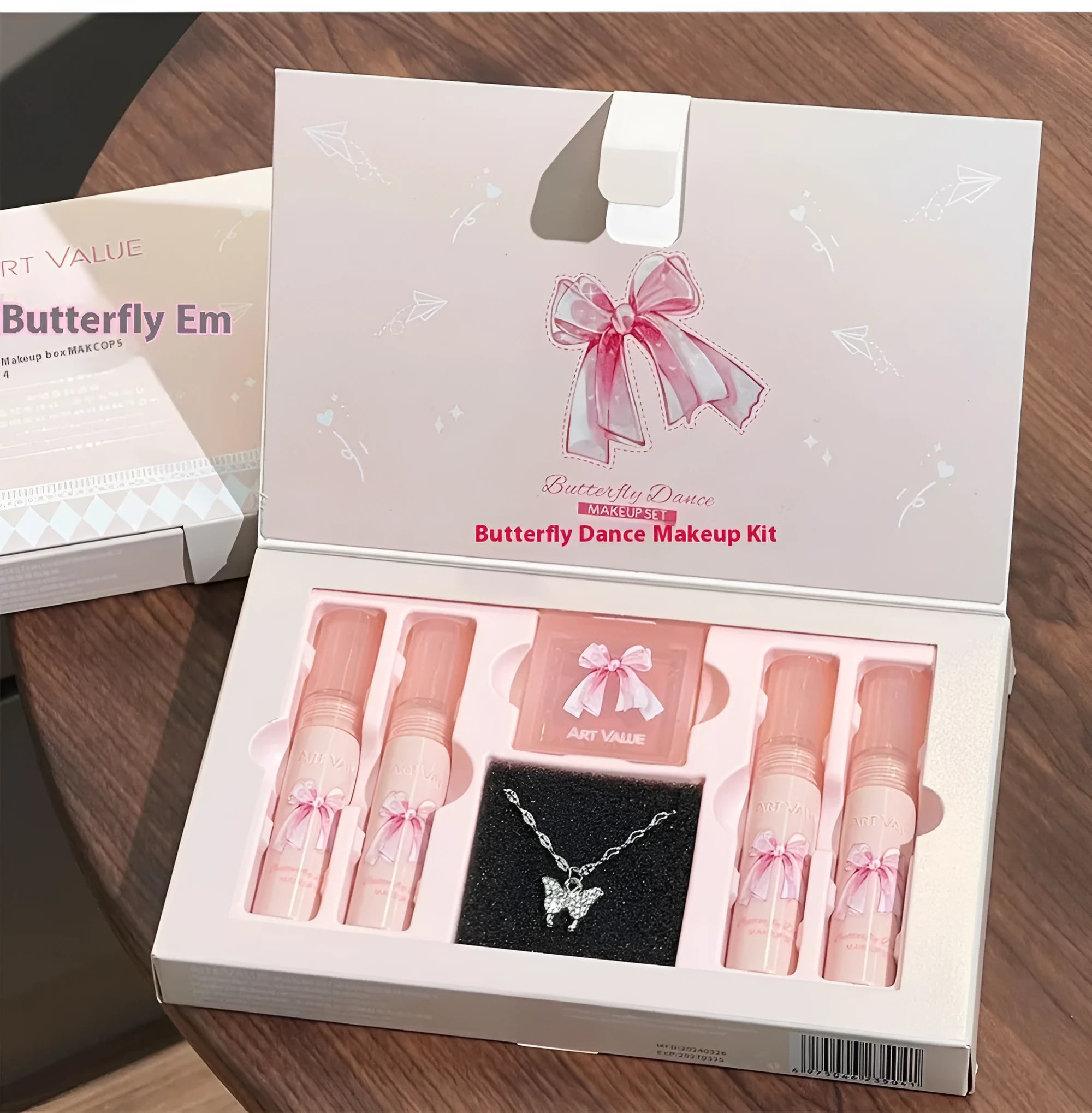 Butterfly Box makeup set containing four pink lip muds, powder blusher and necklace in butterfly packaging